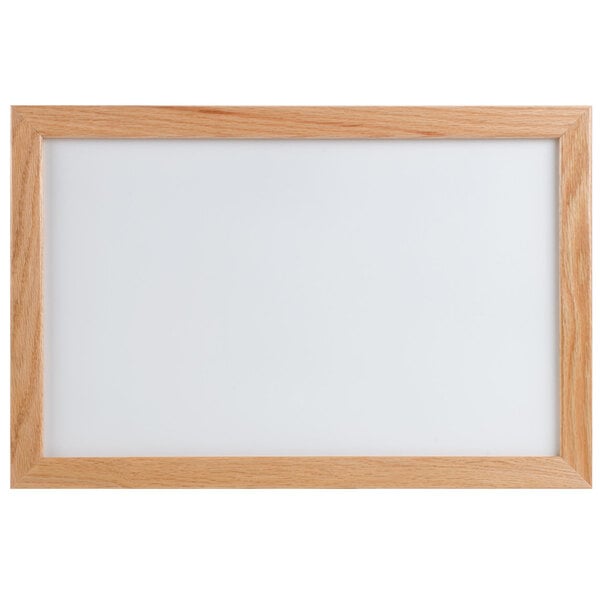 An Aarco oak framed white marker board.
