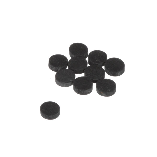 A pile of black rubber Antunes leg bumpers on a white surface.