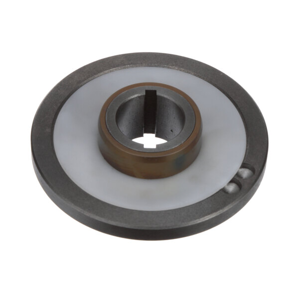 A round metal Salvajor rotor base with a hole in the middle.