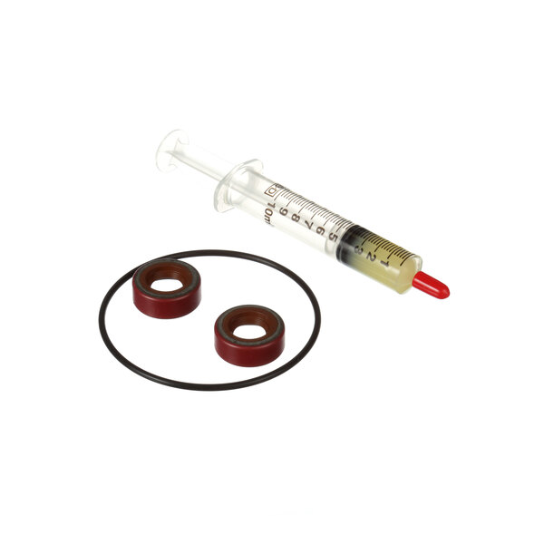 A Pitco seal kit with two rubber seals and a red rubber seal next to a syringe with a red cap.