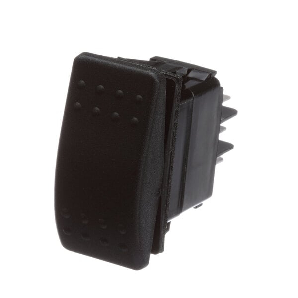 A black square-shaped plastic switch with spikes on the back.
