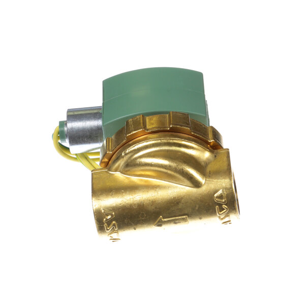 A close-up of a brass and green Groen solenoid valve.