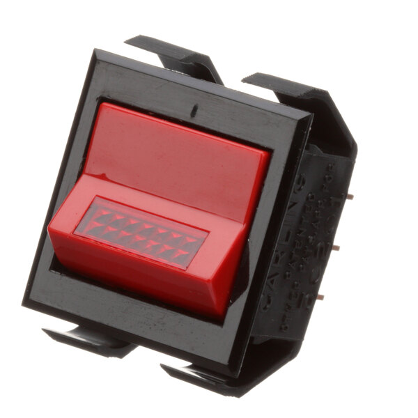 A close-up of a red Vulcan lighted on-off switch with a square button.