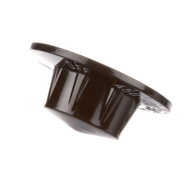 A close-up of a black plastic Vulcan thermostat knob with white text.