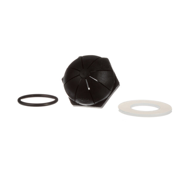 A black rubber round object with a circular design and a round ring.