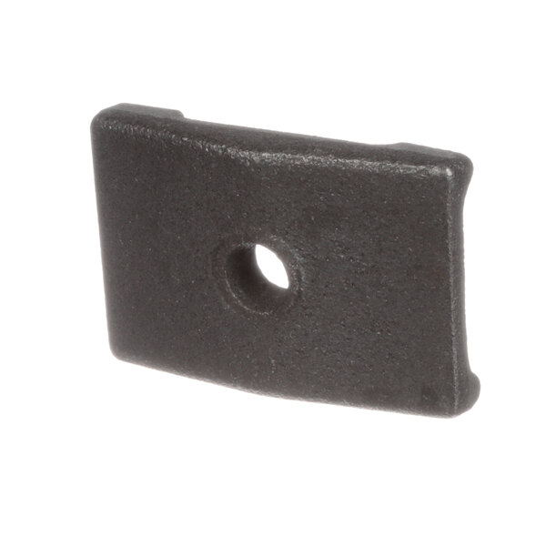 A close-up of a black metal Groen clamp with a hole in it.