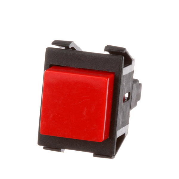 A red push button switch with black plastic holder.