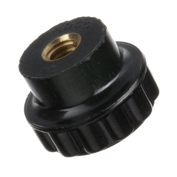 A black plastic nut with a gold thumbscrew.
