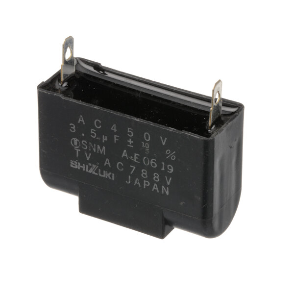 A green rectangular Lincoln capacitor with white text.