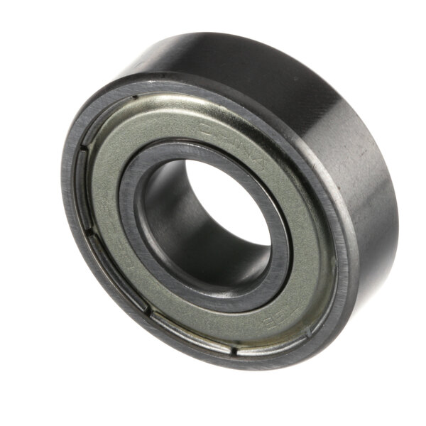 A close-up of a Hobart ball bearing with a black rubber ring and steel ball inside.