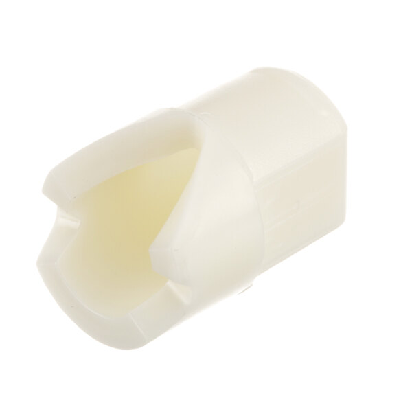 A white plastic Randell nylon insert with a hole.