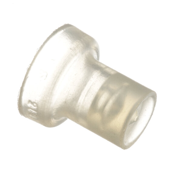 A close-up of a clear plastic pipe fitting with a round cap on a white surface.