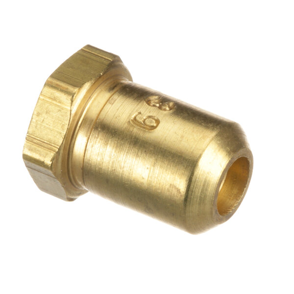 A close-up of a brass nut with a gold metal surface.