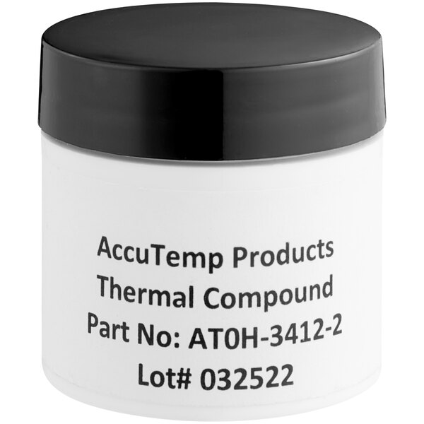 A white Accu-Temp container of thermal paste with a black lid.