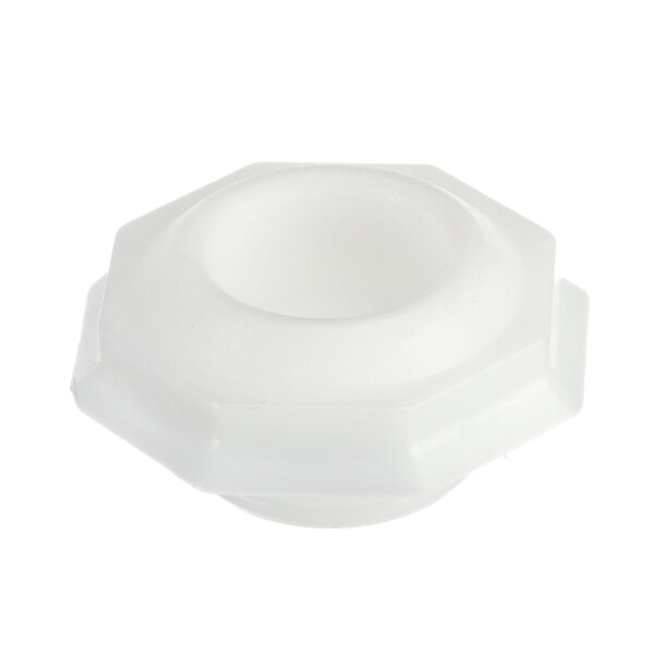 A white plastic hexagon-shaped nut with a hole.