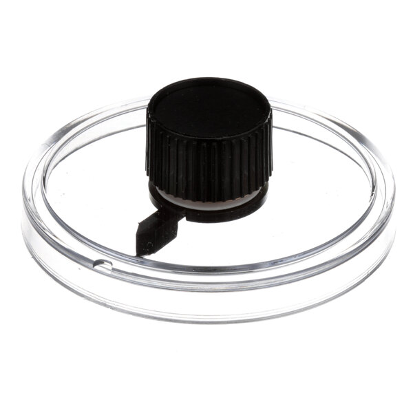 A clear plastic container with a black knob on top.