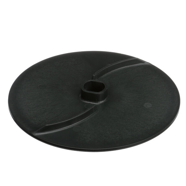 A black plastic disc with a square hole.