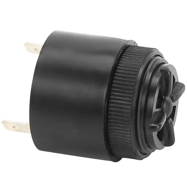 A black round plastic cap with a black round device inside.
