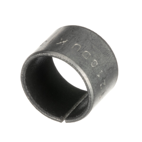 A close-up of a black metal ring with a hole in it.