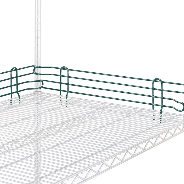 A Metro L14N-4K3 Metroseal wire rack ledge on a metal shelf with green rails.
