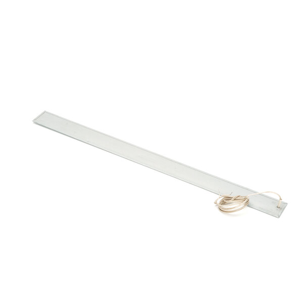 A long white rectangular light fixture with a wire attached.