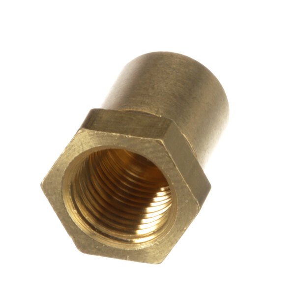 A close-up of a brass threaded nut with a hole.