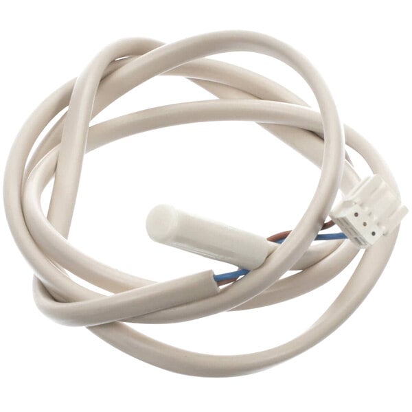 A white cable with a white connector and a blue wire attached to a white object.