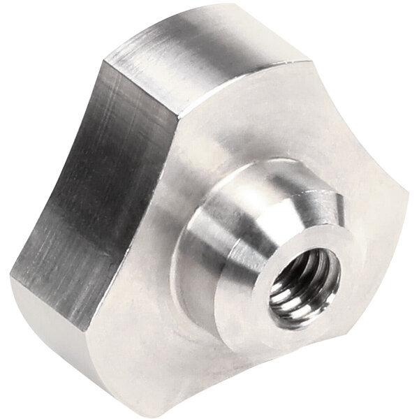 A close-up of a metal knob with a threaded hole.
