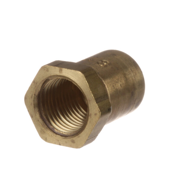A close-up of a brass nut with a screw on a white background.