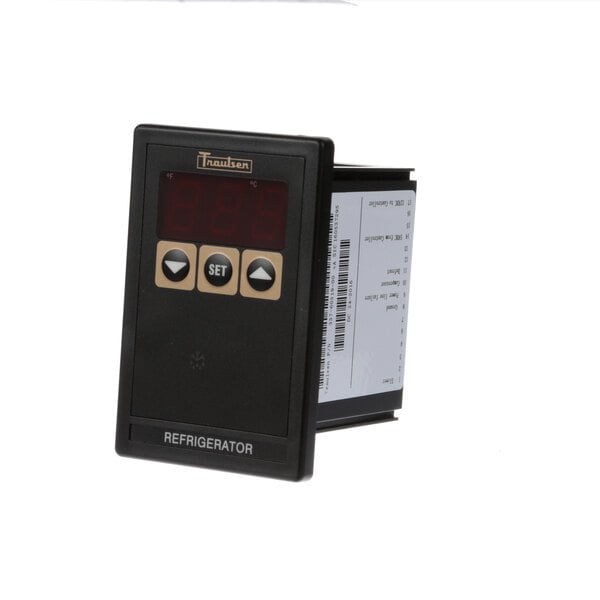 A Traulsen refrigeration control head with a black rectangular device and a digital display.