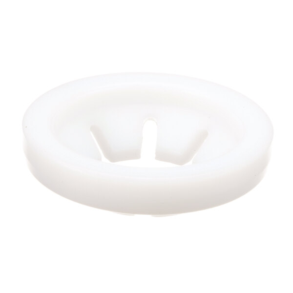A white plastic Groen piston seal with a hole in the center.
