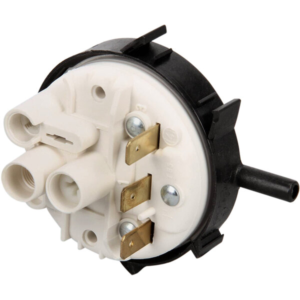 A white and black Jet Tech pressure switch with two wires.