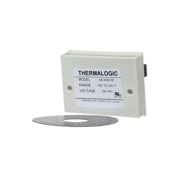 A white rectangular Crown Steam thermostat with a label.