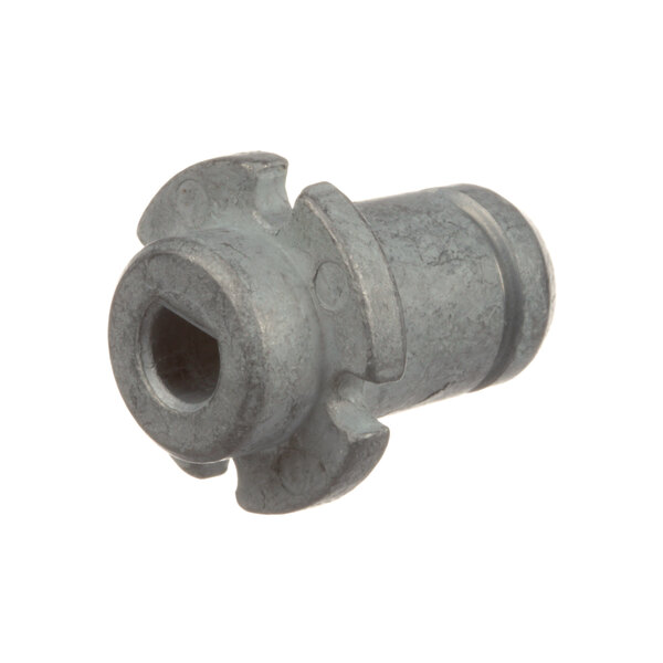 A close-up of a metal nut with a hole in it.