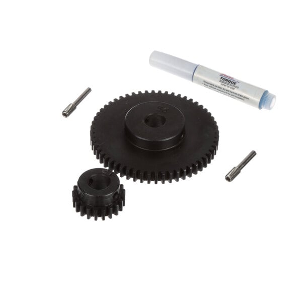 A black gear with a white marker and screws.