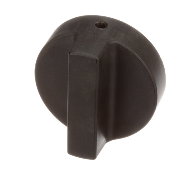 A black plastic knob with a rectangular white border and a hole.