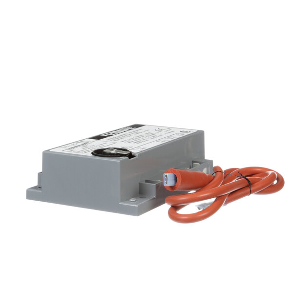 A grey rectangular Middleby Marshall ignition module with an orange cable.