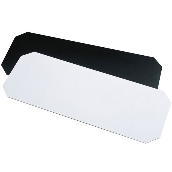 A black rectangular Metro shelf inlay with a white label on a white surface.
