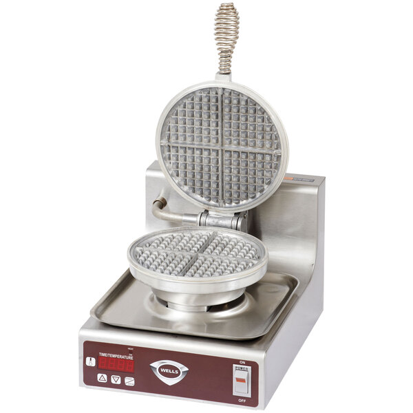 A Wells commercial waffle maker with a round waffle pattern and a lid.