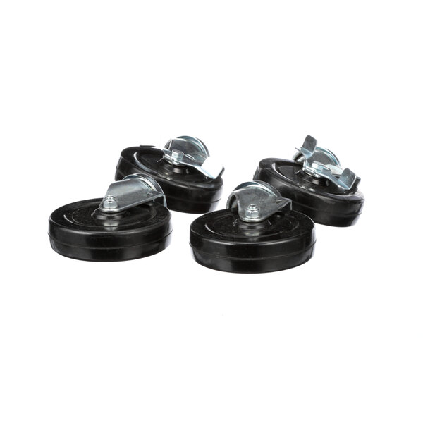 A group of black Traulsen casters with metal wheels.