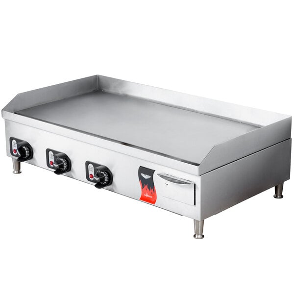 A large stainless steel Vollrath Cayenne electric griddle with knobs.