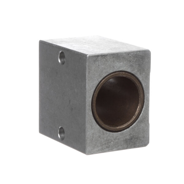 A metal cube with a hole in it.