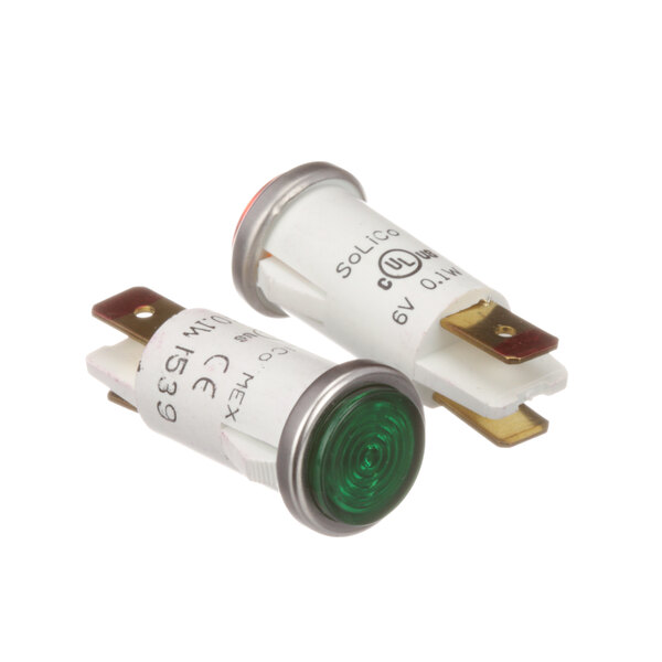 A close-up of two green and silver Antunes indicator lights.