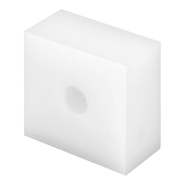 A white cube with a hole in it.