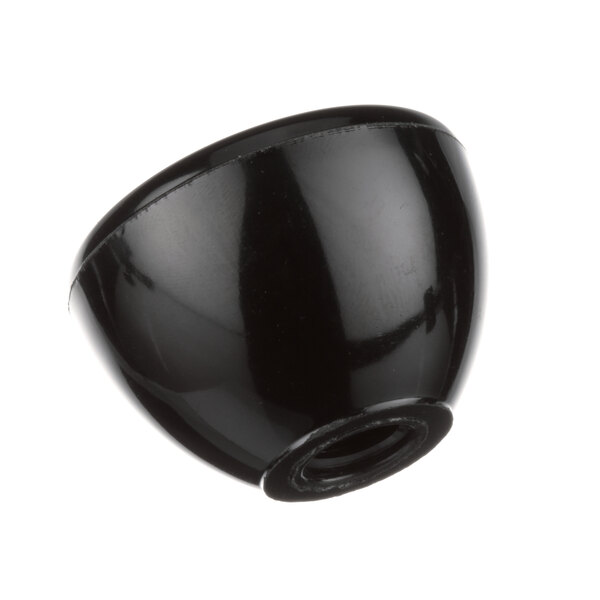 A close up of a black round BKI 202 knob with a hole in the center.