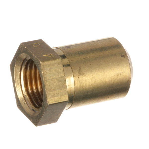 A close-up of a brass nut on a brass cylinder.