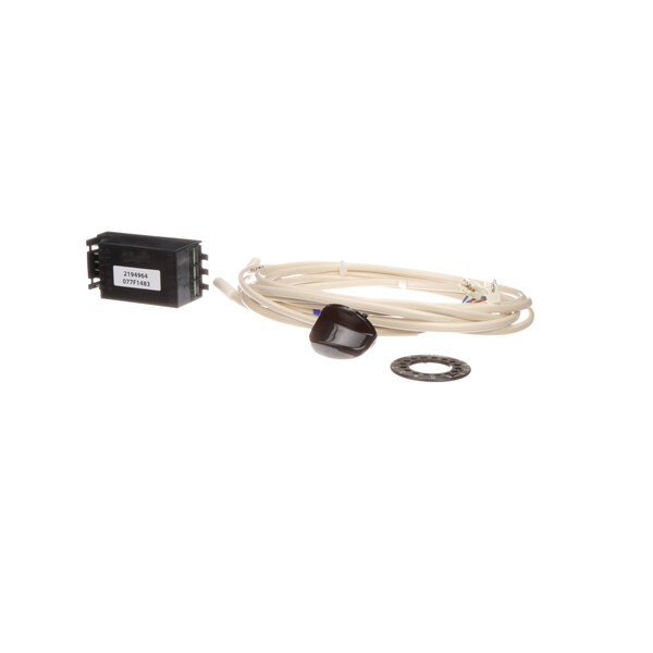 A white cable with a black connector and a black wire attached to a black rectangular object with a white label.