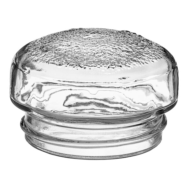 A clear glass jar with a round top.