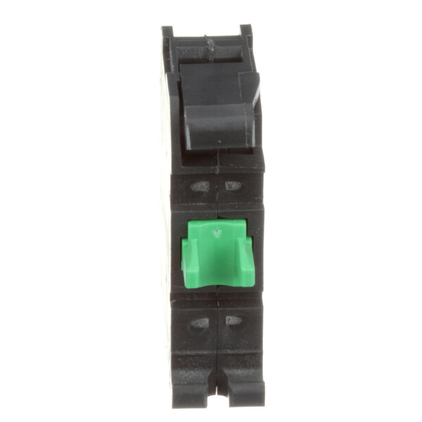 A close-up of a black and green Groen electrical switch turned on with a green light.