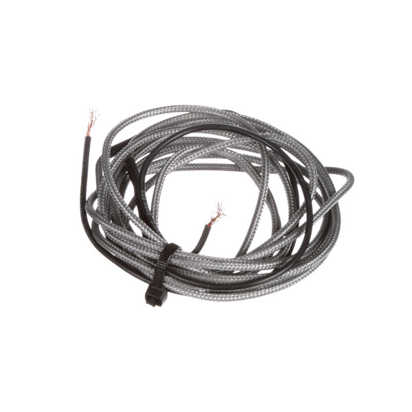 A close-up of a Master-Bilt door frame heater wire with a black and white cable.
